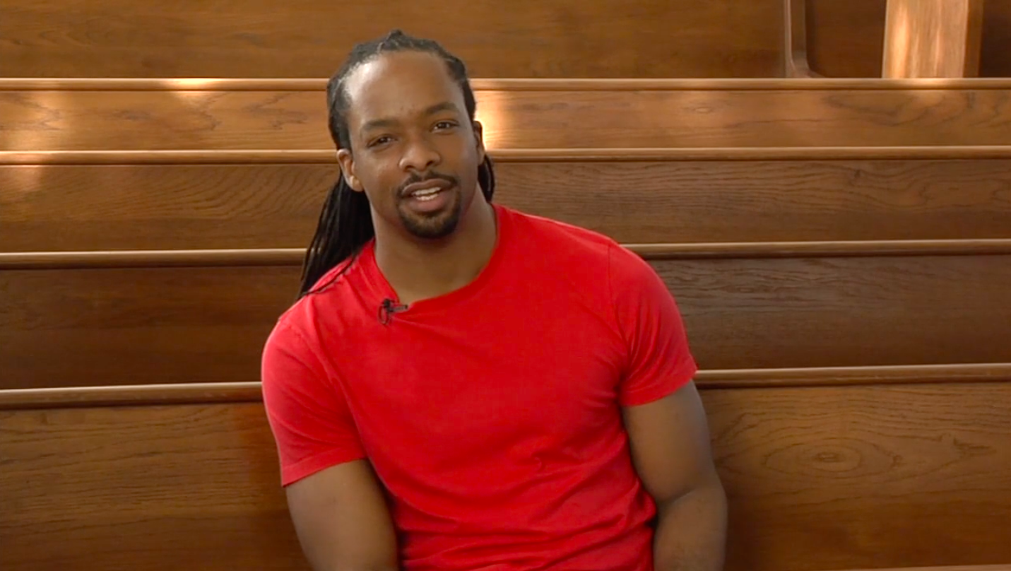 Jericho Brown sitting in church pews