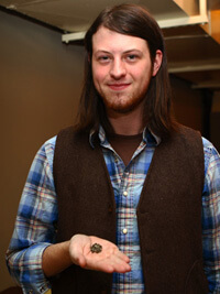 John Hammer, Bo Bennett, UCA student, holding okra seed, Ozark Seed Swap, Mountain View, Arkansas, 2009.  He traded his grandfather’s Moon and Stars watermelon seed at the Swap.