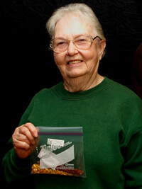 John Hammer, Willodean Smyth with her family heirloom variety Pencil Cob Corn, Ozark Seed Swap, Mountain View, Arkansas, 2009.