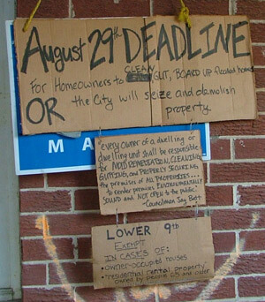 Lynn Weber, Signs about housing demolition, Lower Ninth Ward, New Orleans, Louisiana, 2005.