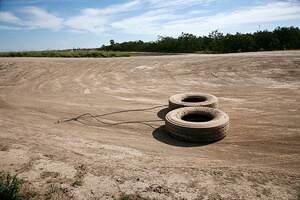 Susan Harbage Page, Tires dragged along roads by the Border Patrol to see fresh footprints left by immigrants, Brownsville, Texas, 2010.