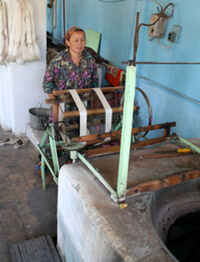 Mary E. Frederickson, Winding skeins of silk, Margilan, Uzbekistan, 2006.