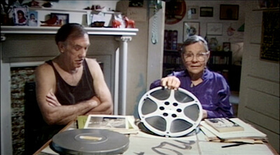 Ronnog Seaberg holds up the reel of J.B. Lenoir footage she and her husband shot in Chicago in 1965. The Soul of a Man, 2003.