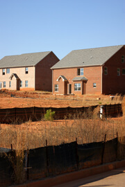 John Howard, Unsold houses amid red clay, Henry County, Georgia, November 2008.