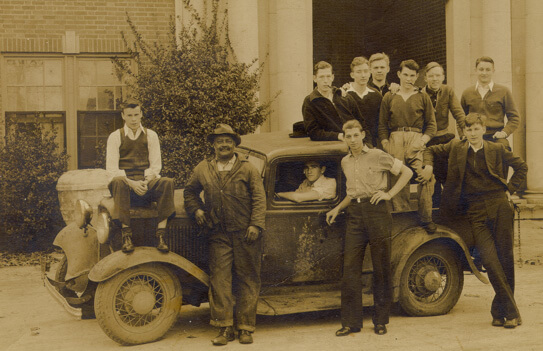 Photographer unknown, College groundskeeper and chief janitor Henry "Billy' Mitchell with Emory at Oxford students, c. 1940. Collection of J.P. Godfrey, Jr.