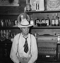 Russell Lee, Library of Congress, Prints & Photographs Division FSA-OWI Collection Reproduction Number: LC-USF34-031581-D DLC, Cajun proprietor of barroom, Crowley, Louisiana, 1938. 