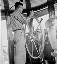 Russell Lee, Library of Congress, Prints & Photographs Division FSA-OWI Collection Reproduction Number: LC-USF33-011806-M4 DLC, Tugboat captain on Mississippi River, 1938. 