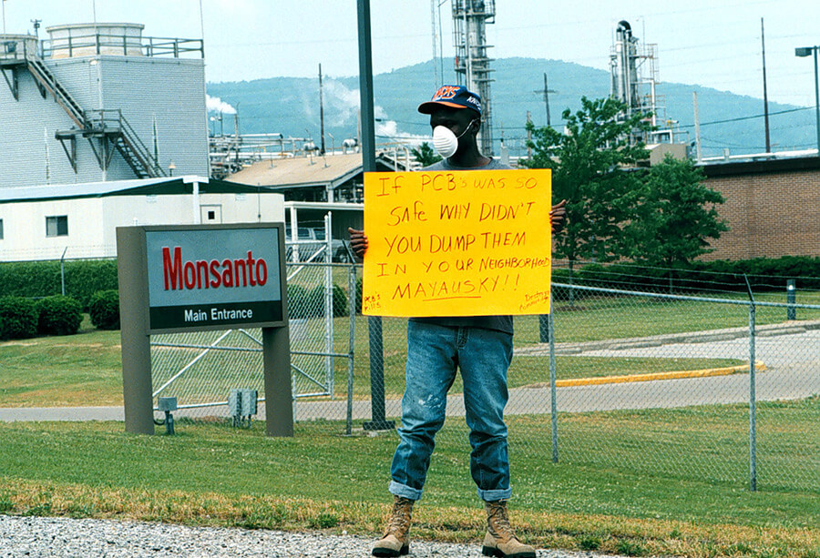 PCB Activist Herman Frazier protests Monsanto's Sweet Valley/Cobbtown relocation plan, Anniston, Alabama, 1996. Photo by Bill Wilson, Anniston Star. Reproduced here from Baptized in PCBs, 76. Courtesy of Ellen Spears.