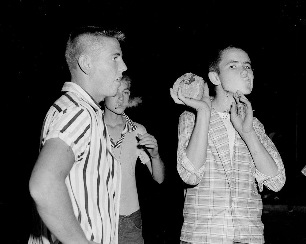 A young demonstrator wields a rock. Nashville, TN, September 1957. © Nashville Public Library.​​