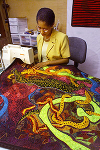 Gwen Magee at work on her abstract design Bolero. Photography by J.D. Schwalm and The Clarion-Ledger, 2001. 