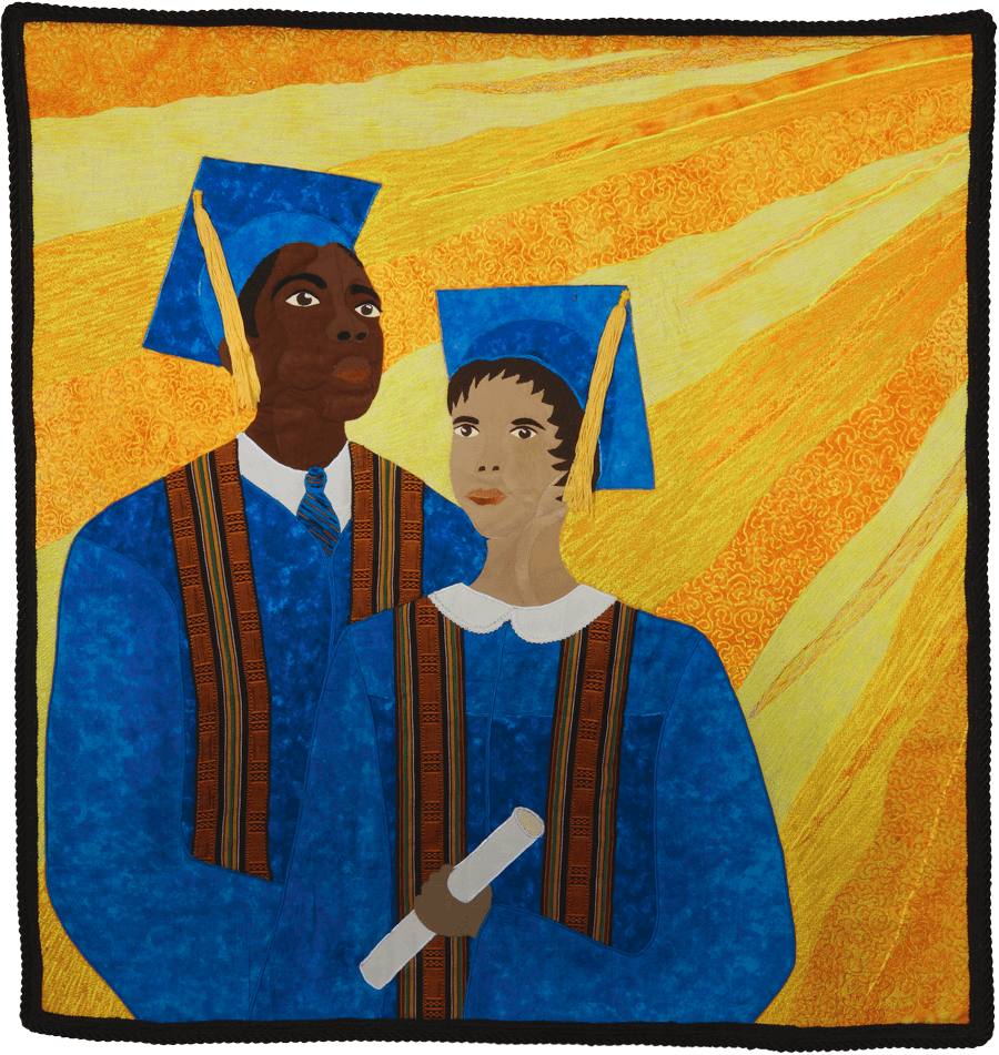 A young Black man and Black woman, dressed in blue graduation gowns and caps, are illuminated by the rays of the sun shining from the upper right of this quilt panel