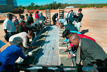 New hospital, Lithonia, Georgia, October 23, 2003. VIPs sign cement during the foundation pouring ceremony at South DeKalb Medical Center for the first full-service hospital in south DeKalb. Photograph by HIP Incorporated © 2003.