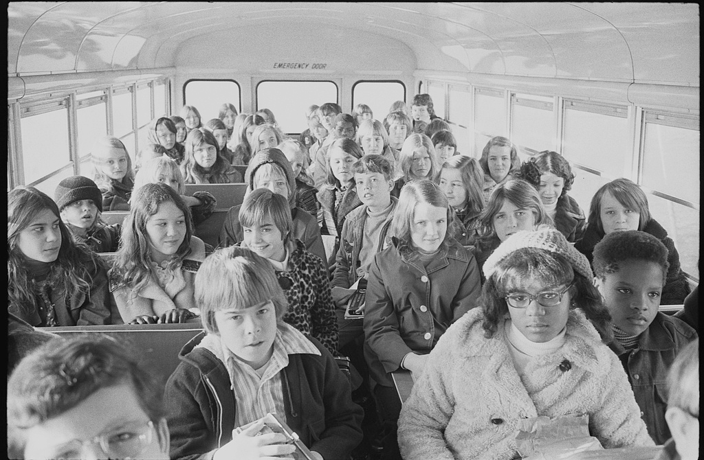 African American and white school children on a school bus, riding from the suburbs to an inner city school, Charlotte, North Carolina, Feburary 21, 1973. Photograph by Warren K. Leffler. Courtesy of the Library of Congress Prints and Photographs Division, loc.gov/pictures/resource/ds.00762.