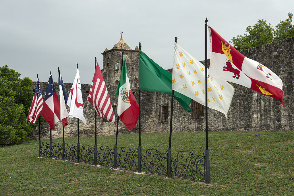 Nine flags, Presidio La Bahia, Goliad, Texas, April 5, 2014. Photograph by Carol M. Highsmith. Courtesy of the Carol M. Highsmith Collection, Library of Congress Prints and Photographs Division, http://www.loc.gov/resource/highsm.29287/.  The flags, pictured left to right, represent states and revolutionary forces that once ruled Texas territory: the United States of America, the Confederate States of America, the Republic of Texas, Captain Phillip Dimmitt's Goliad Insurrection, James Long's Second Republic of Texas, Mexico, the First Republic of Texas, France, and Spain.