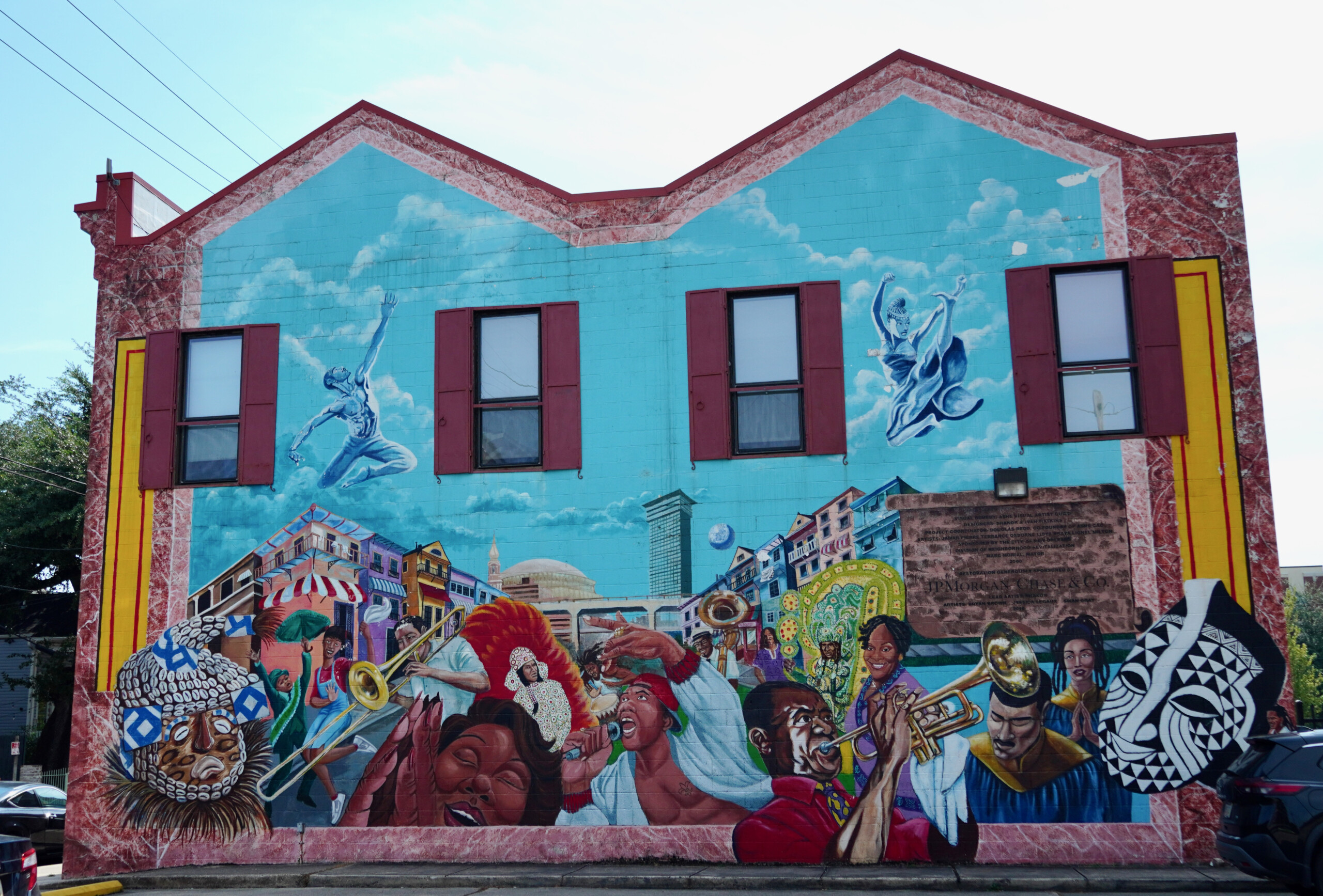 The main exterior mural at the Ashé Cultural Arts Center in New Orleans, celebrating Central City cultural performers.