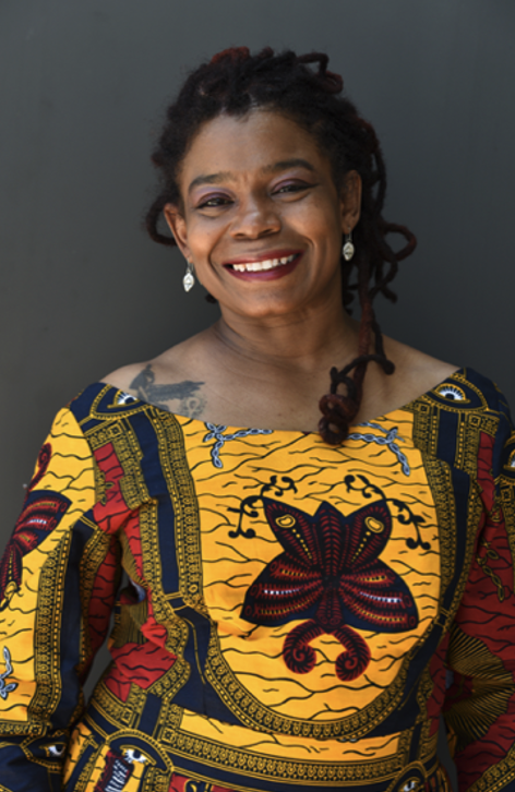 Portrait photo of Asali DeVan Ecclesiastes in colorful outfit.