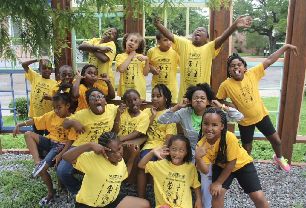 Children posing and making faces as participants in Kuumba.