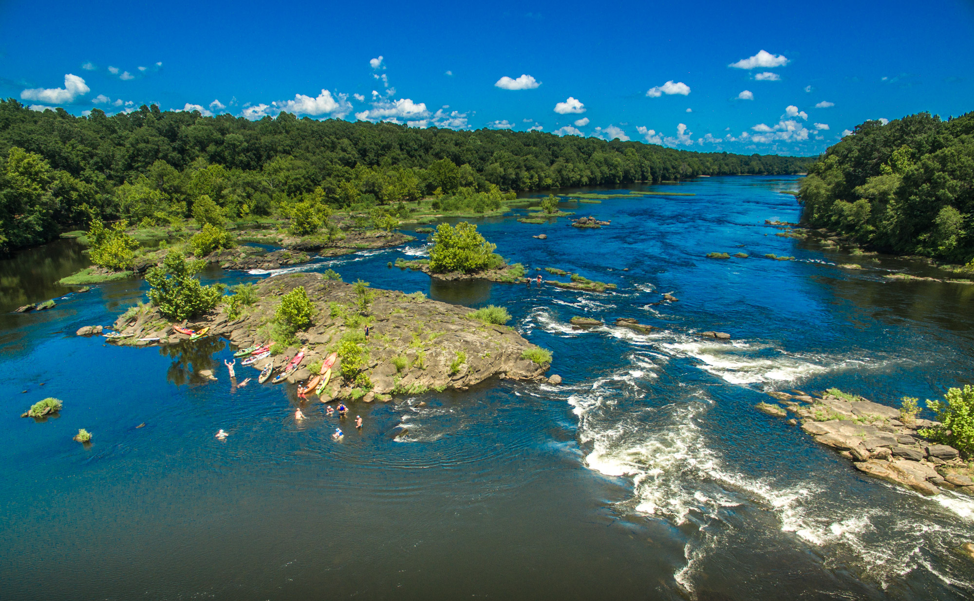 Riverscape with swimmers.